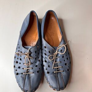These blue perforated leather shoes are the Spring Step Moonwalk loafer